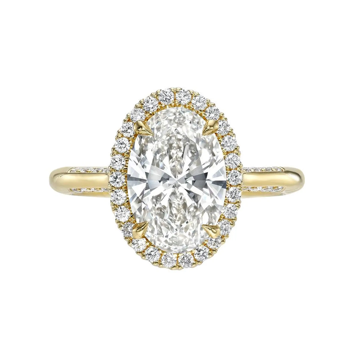 Top view of a yellow gold 3 CT oval lab diamond engagement ring with diamond halo.