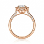 Side profile view of a 3 carat oval lab diamond halo ring in yellow gold with sculpted floral basket.