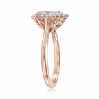 Side angle view of a rose gold 3 CT oval cut lab grown diamond halo ring with milgrain accents.
