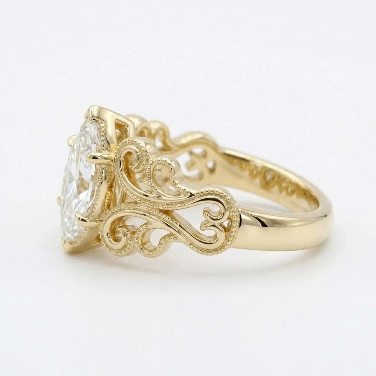 Angled perspective view of a 4 carat marquise cut lab grown diamond ring with milgrain scrollwork band.