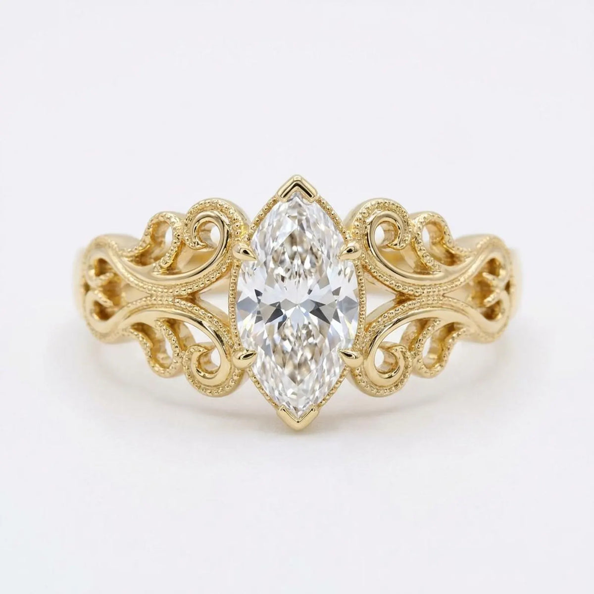 Top-down view of a 4 CT marquise cut lab grown diamond engagement ring with ornate filigree shoulders in yellow gold.