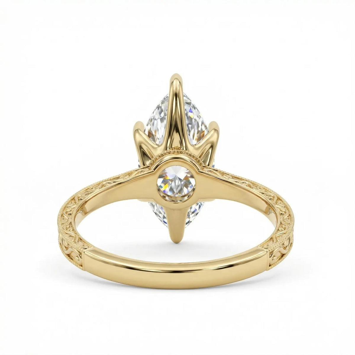 Bottom perspective view of a yellow gold 4 CT marquise lab diamond ring showing the open undergallery and engraved band.