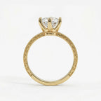 Side profile view of a yellow gold 4 CT marquise lab grown diamond ring with 6-prong crown basket and scrollwork band.