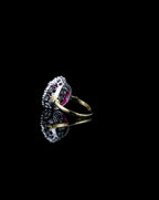 side-profile-angle-of-3-ct-red-oval-cut-moissanite-halo-ring-with-two-tone-band