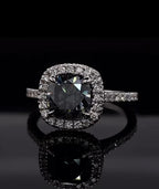 Close up of the brilliant facets on a 3 CT grey cushion cut moissanite stone.