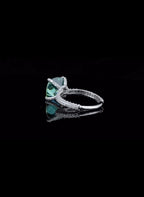 profile-view-showing-pave-band-and-prong-setting-of-green-cushion-moissanite-ring