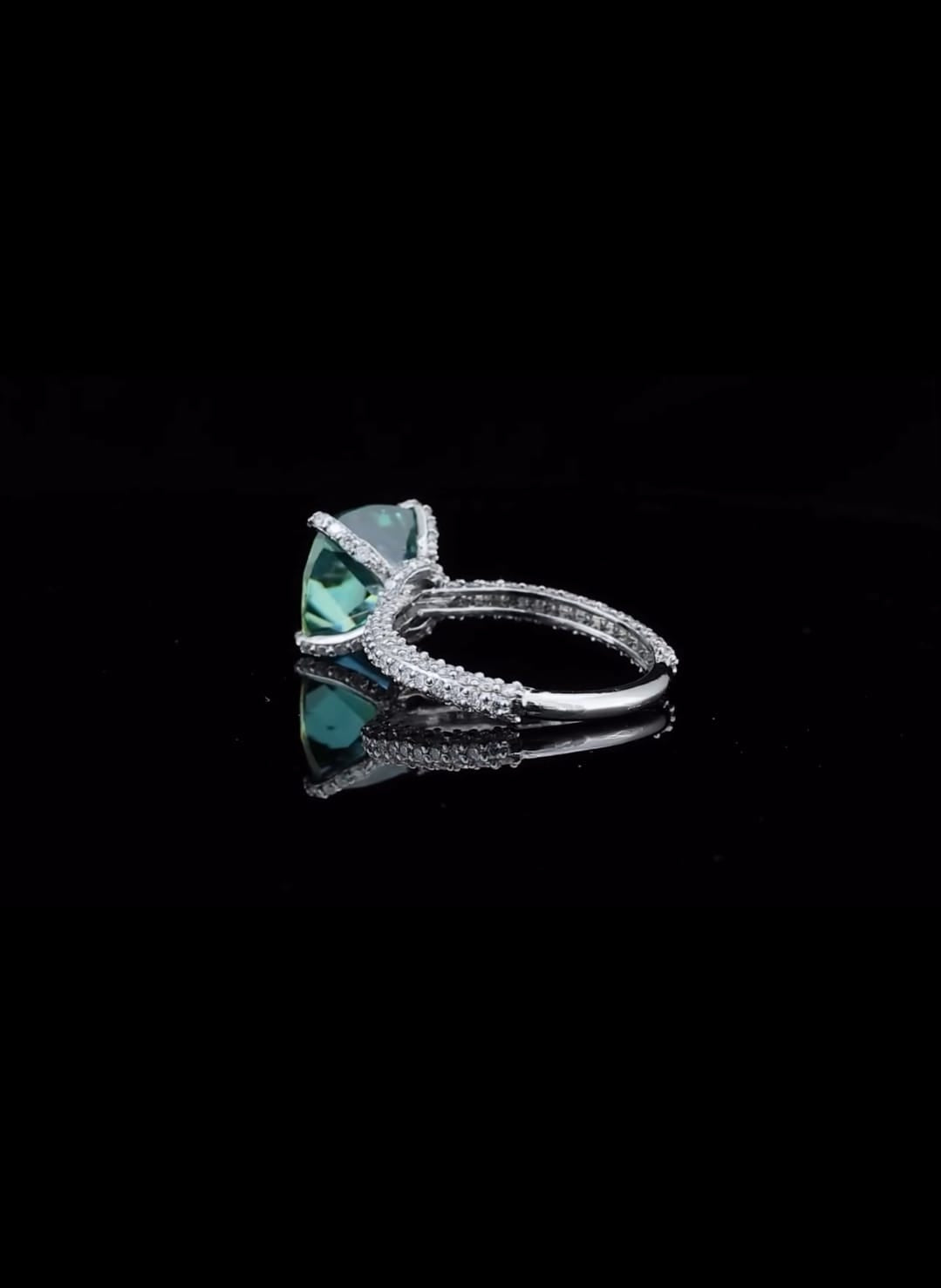 profile-view-showing-pave-band-and-prong-setting-of-green-cushion-moissanite-ring