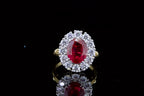 top-down-view-displaying-vibrant-red-oval-center-stone-and-diamond-halo