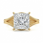 Top-down view of a 3 CT princess cut lab grown diamond ring with open split shank band in yellow gold.