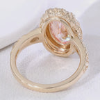 Undergallery view showing the polished interior band and oval setting of a 4 CT pink lab diamond yellow gold ring.