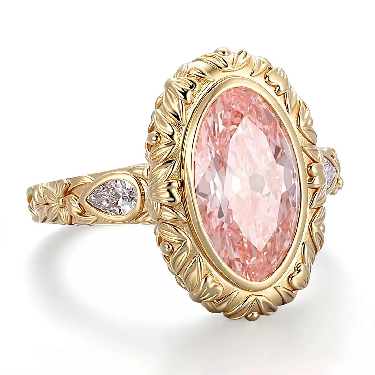 Angled view of a 4 carat blush pink oval lab grown diamond ring framed by a sculpted leaf bezel and pear side accents.