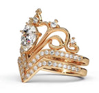 Front-left angled view showcasing the full crown tiara peak, center lab diamond, and micro-pavé chevron wedding band.
