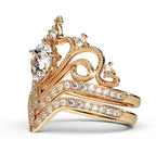 High-angle profile shot displaying the intricate gold scroll detailing, diamond setting, and stacked band fit.