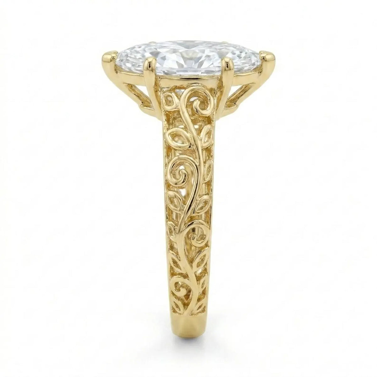 Side profile view showing intricate openwork filigree scrollwork on the yellow gold band of a 3 CT marquise lab diamond ring.