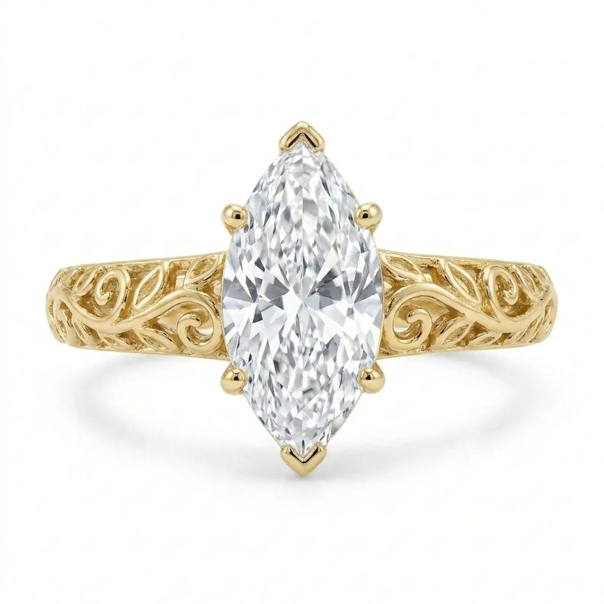 Direct top-down view of a 3 CT marquise cut lab grown diamond ring with vintage leaf filigree band in yellow gold.