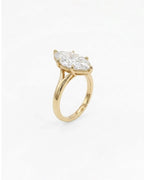 Perspective angled view of a 4 carat marquise cut lab diamond solitaire ring with 6-prong head in 14K yellow gold.   