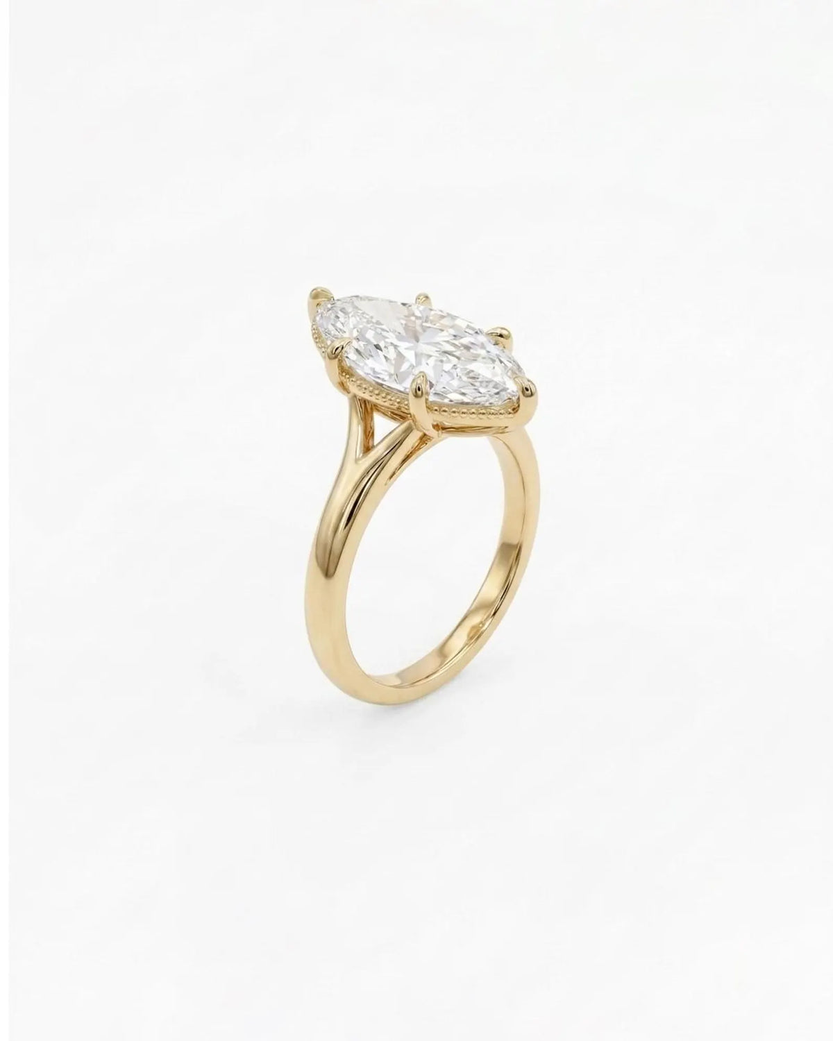 Perspective angled view of a 4 carat marquise cut lab diamond solitaire ring with 6-prong head in 14K yellow gold.   