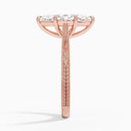 Side profile view of a 3 CT marquise lab diamond engagement ring showing hand-engraved scrollwork on a rose gold band.   