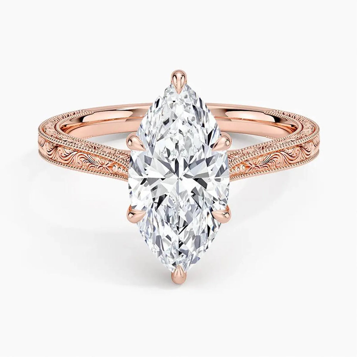Top-down view displaying a 3 CT marquise lab grown diamond set in 6 prongs on a rose gold engraved band.