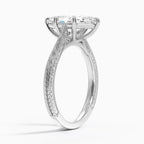 Perspective angled view of a 3 CT marquise cut lab diamond vintage ring with carved pattern on a white gold shank.