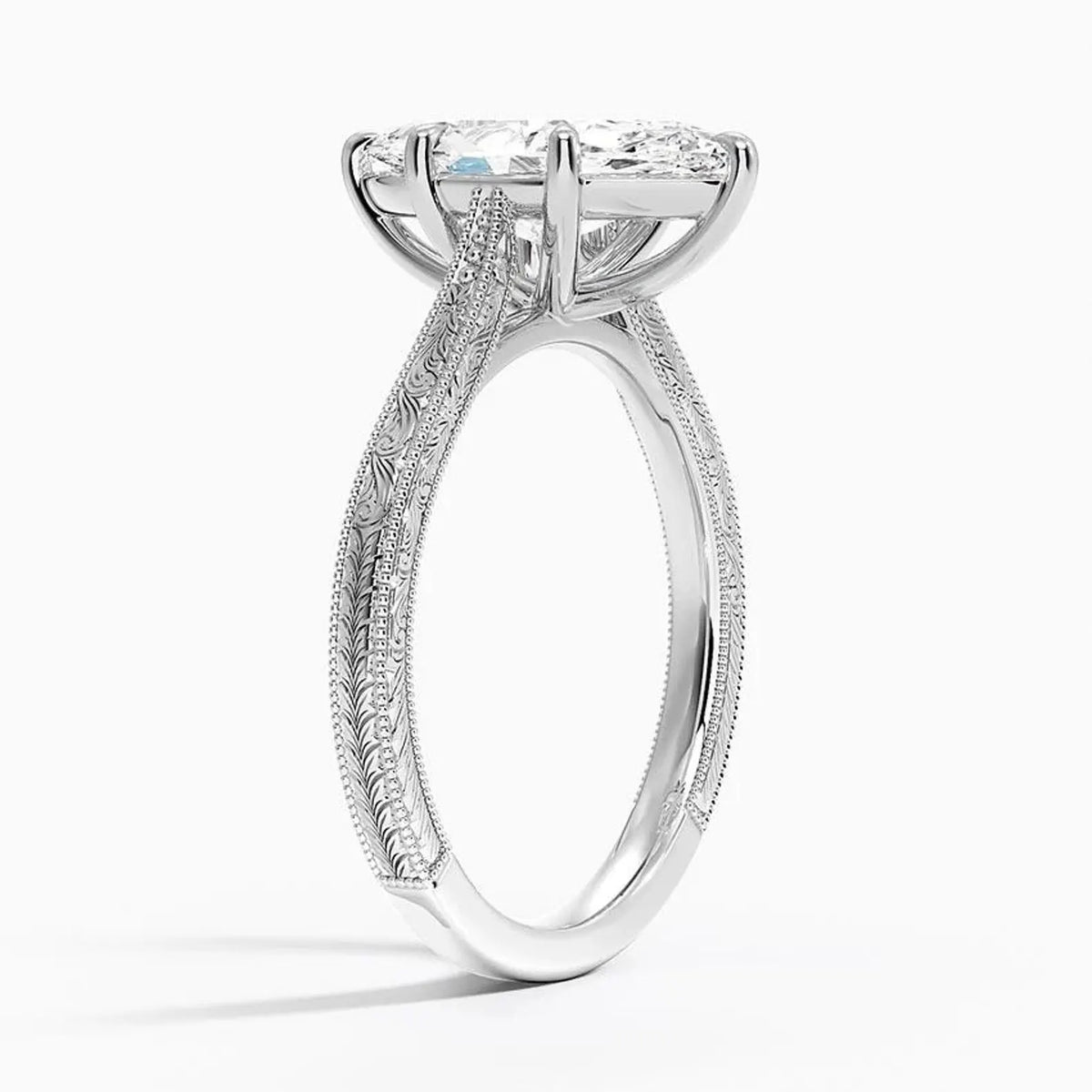 Perspective angled view of a 3 CT marquise cut lab diamond vintage ring with carved pattern on a white gold shank.