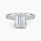 Direct top-down view of a 3 CT emerald cut lab grown diamond solitaire ring on an engraved white gold band.