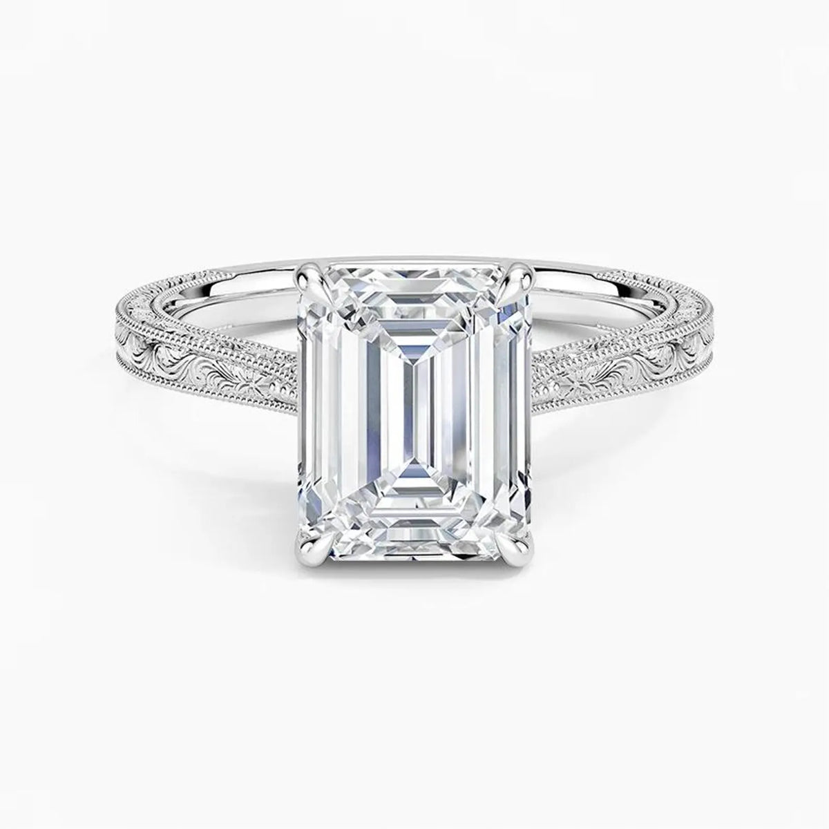 Direct top-down view of a 3 CT emerald cut lab grown diamond solitaire ring on an engraved white gold band.