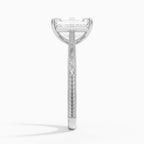 Side profile view of a 3 CT emerald cut lab diamond ring with carved scrollwork on a white gold shank.   
