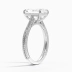 Perspective angled view of a 3 CT radiant cut lab diamond engagement ring with carved scrollwork in white gold.
