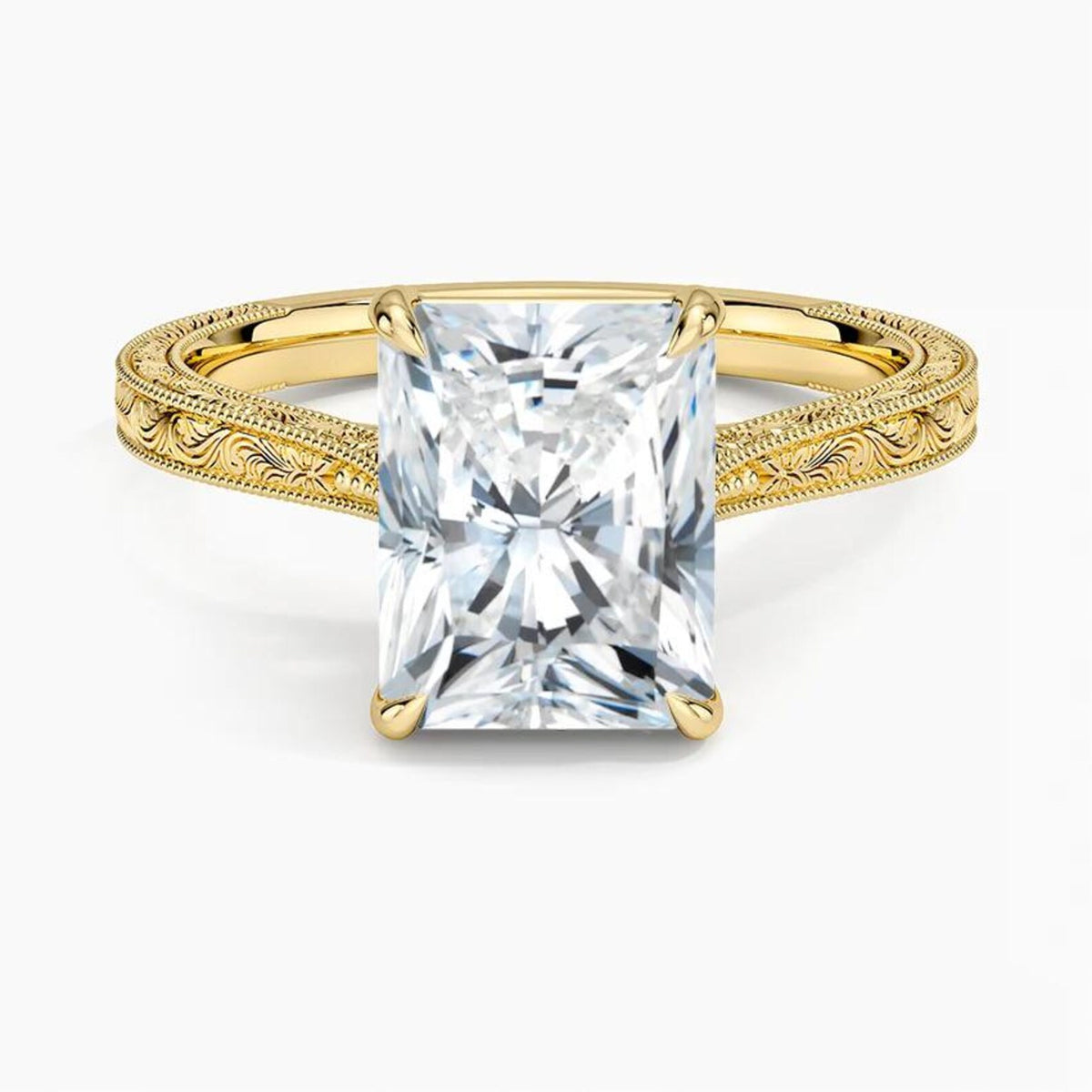 Direct top-down view of a 3 CT radiant cut lab grown diamond engagement ring on an engraved yellow gold band.