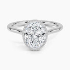 Front perspective view of a 3 CT oval lab diamond engagement ring in a milgrain bezel white gold setting.