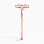 Direct side profile view of a rose gold oval diamond engagement ring with a milgrain bezel edge.