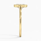 Side view showing yellow gold band and low-profile oval diamond milgrain bezel setting.