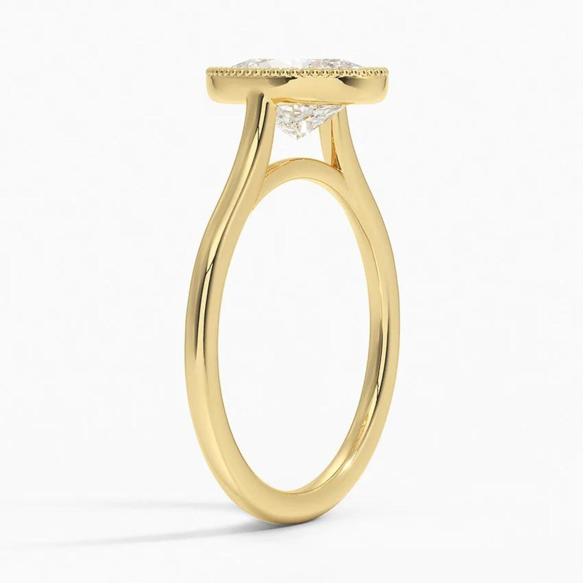 Angled profile view of a yellow gold 3 CT oval lab diamond ring with a delicate milgrain bezel.
