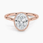 Top perspective view of a 3 CT oval lab grown diamond ring with milgrain bezel frame on a rose gold band.