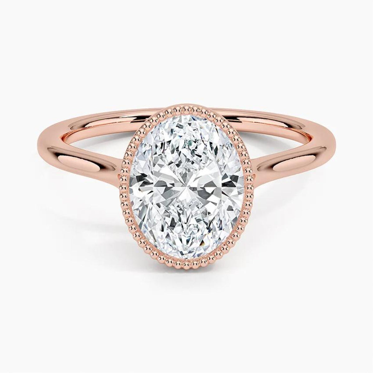 Top perspective view of a 3 CT oval lab grown diamond ring with milgrain bezel frame on a rose gold band.