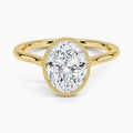 Top perspective view displaying a 3 CT oval cut lab diamond engagement ring in yellow gold.
