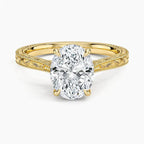 Direct top perspective view of a 3 CT oval cut lab grown diamond engagement ring on an engraved yellow gold band.   