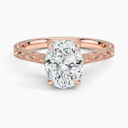 Direct top perspective view of a 3 CT oval cut lab grown diamond solitaire ring on an engraved rose gold band.