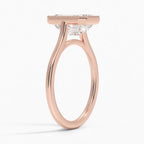 Three-quarter profile view of a 4 CT emerald cut lab grown diamond engagement ring with milgrain bezel frame in rose gold.