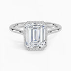 Top-down direct view of a 4 CT emerald cut lab grown diamond ring framed by delicate milgrain in white gold.