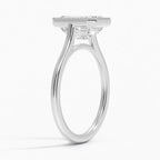 Three-quarter side angle showing the open setting and milgrain bezel edge of a 4 CT emerald lab diamond ring in white gold.