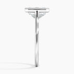 Direct side profile view of a white gold emerald cut lab grown diamond solitaire ring with milgrain detailing.