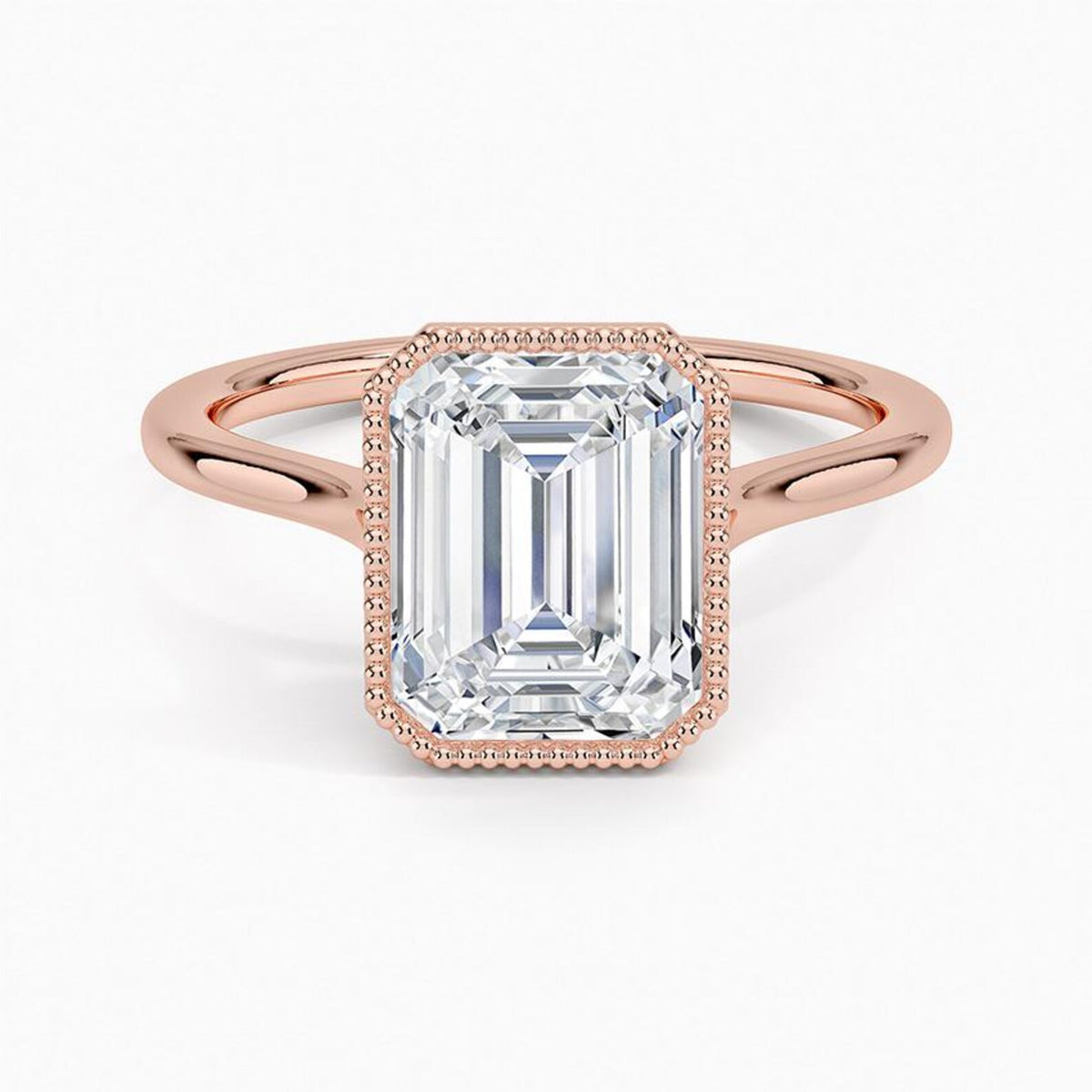 Direct top view of a 4 CT emerald cut lab grown diamond engagement ring set in a rose gold milgrain frame.