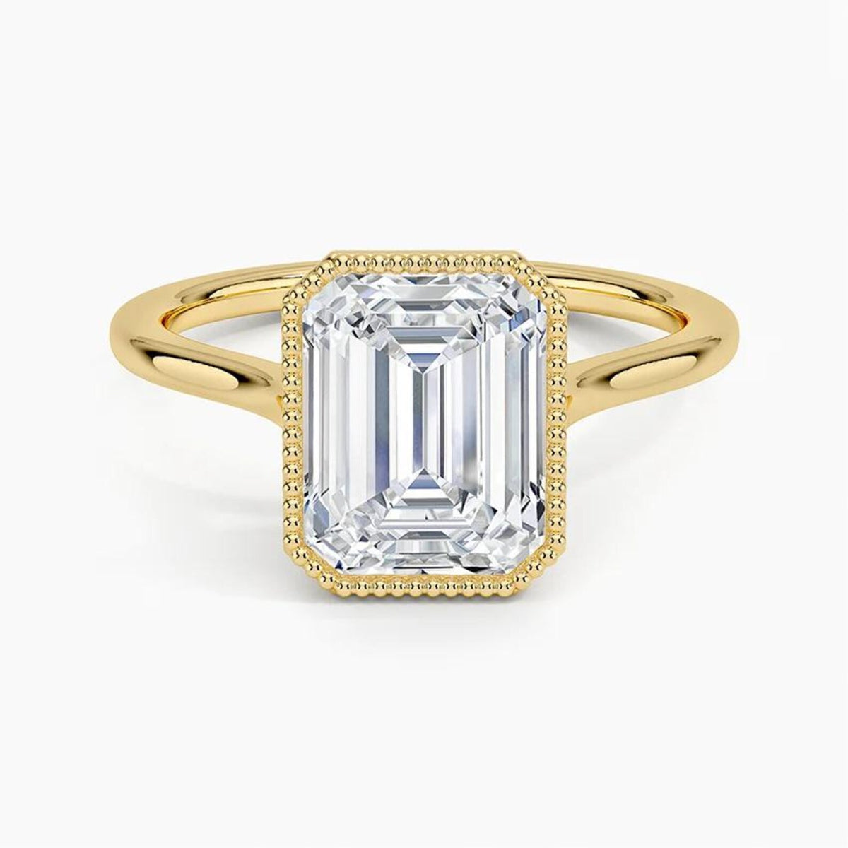 Direct top view of a 4 CT emerald cut lab diamond solitaire ring with a milgrain bezel in yellow gold.