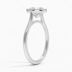 Side angle view of a 3 CT round lab grown diamond engagement ring in white gold showing a milgrain bezel rim and cathedral band.