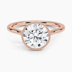 Top-down view showcasing a 3 CT round brilliant lab grown diamond in a rose gold milgrain bezel setting.
