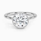 Top-down view of a white gold engagement ring featuring a 3 CT round cut lab grown diamond in a milgrain bezel setting.