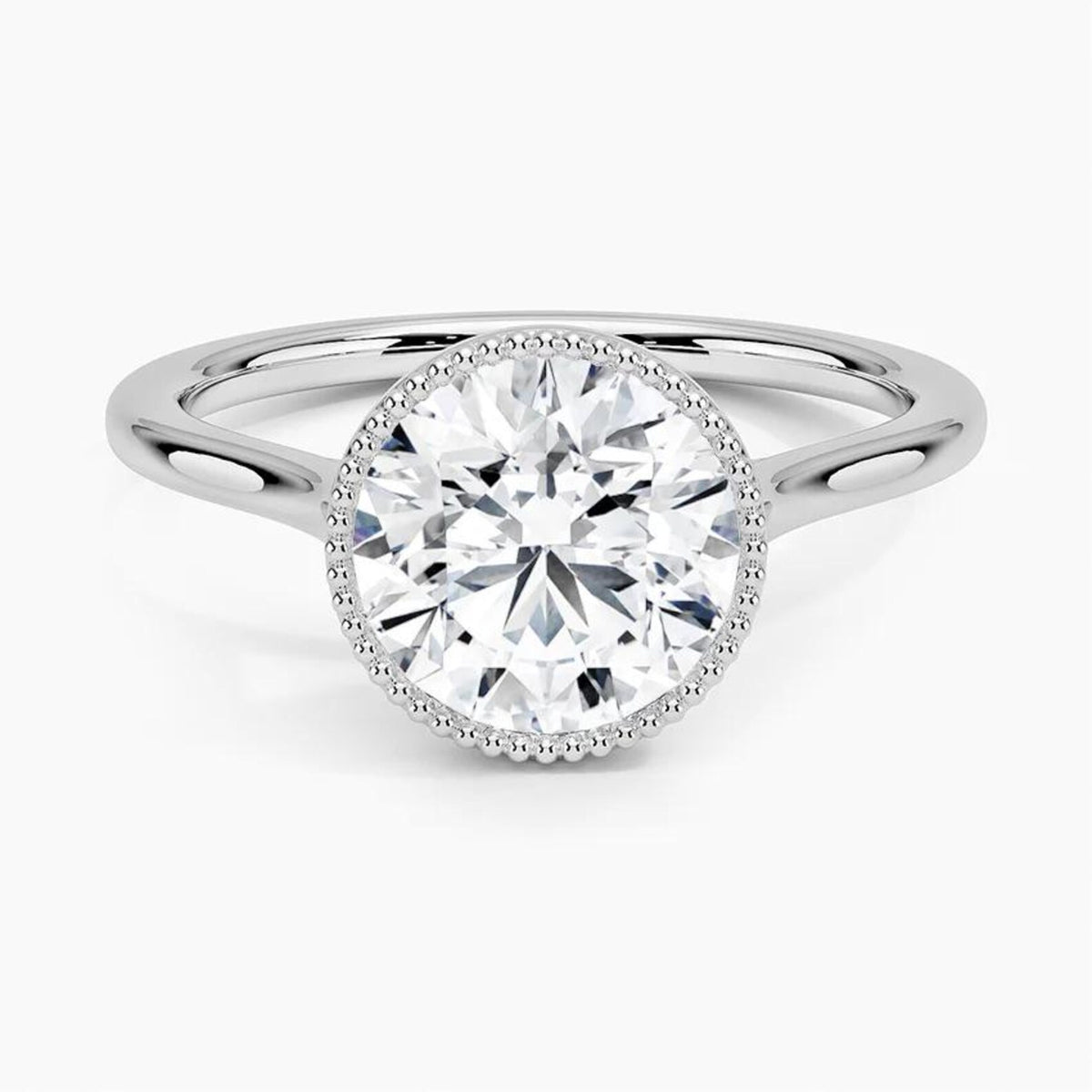 Top-down view of a white gold engagement ring featuring a 3 CT round cut lab grown diamond in a milgrain bezel setting.