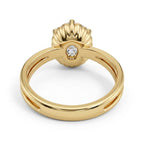 Underside view of a 3 CT oval lab diamond engagement ring in yellow gold showing the scalloped basket and hidden accent diamond.